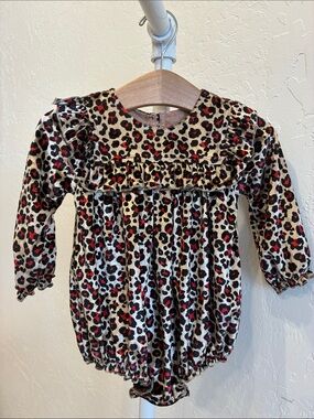 Pink Chicken Leopard Print Long Sleeve One-Piece in Cream, Black, Red